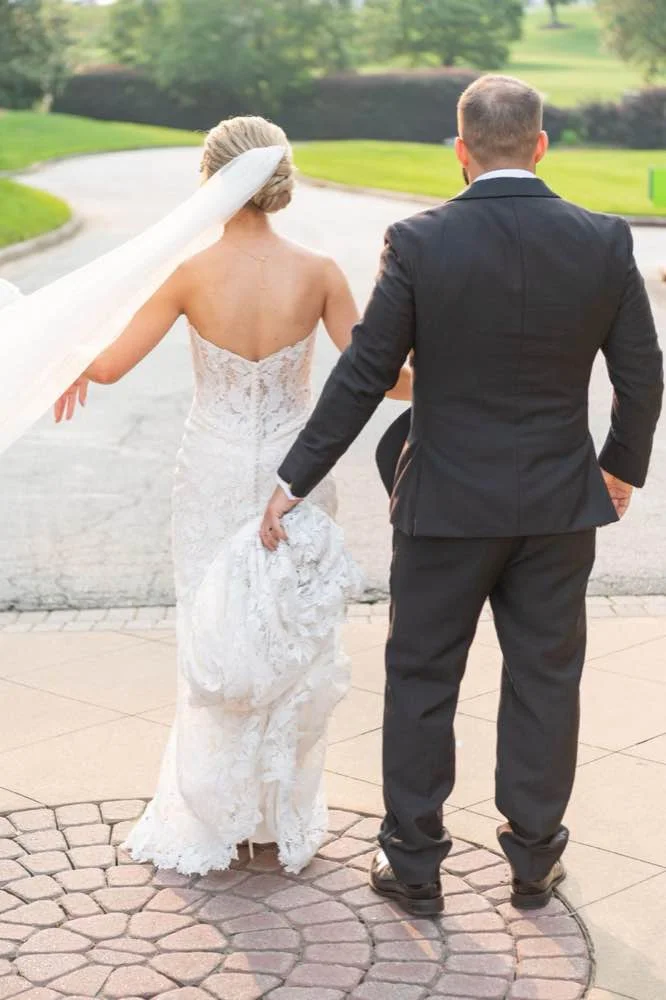 Bride and groom walking at Fernbank Museum